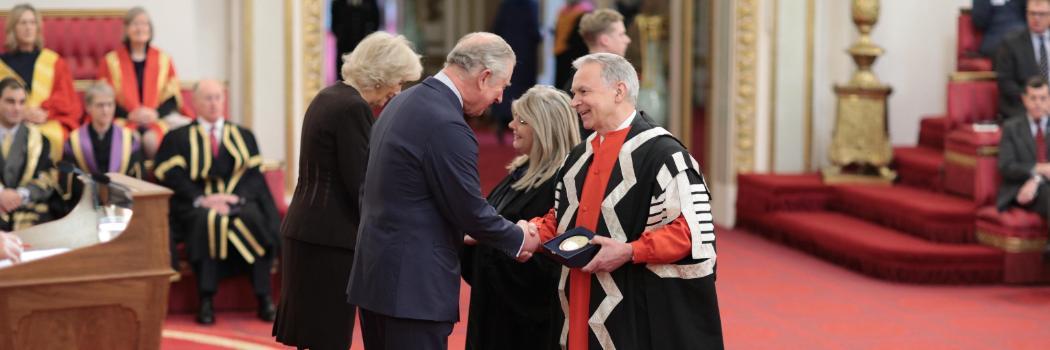 Receiving award at Buckingham Palace
