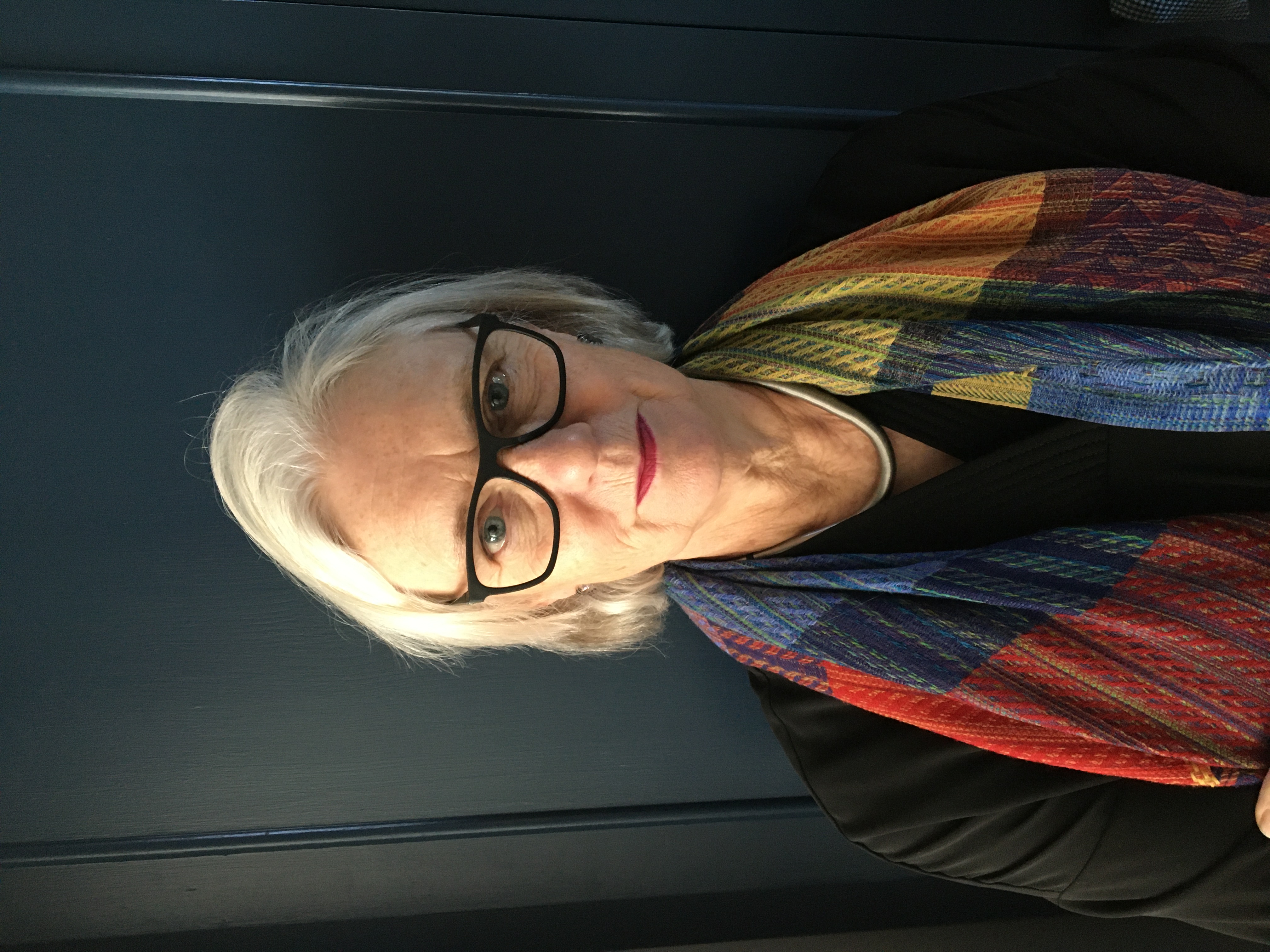 Colour photograph of Professor Elizabeth Edwards, looking at the camera.