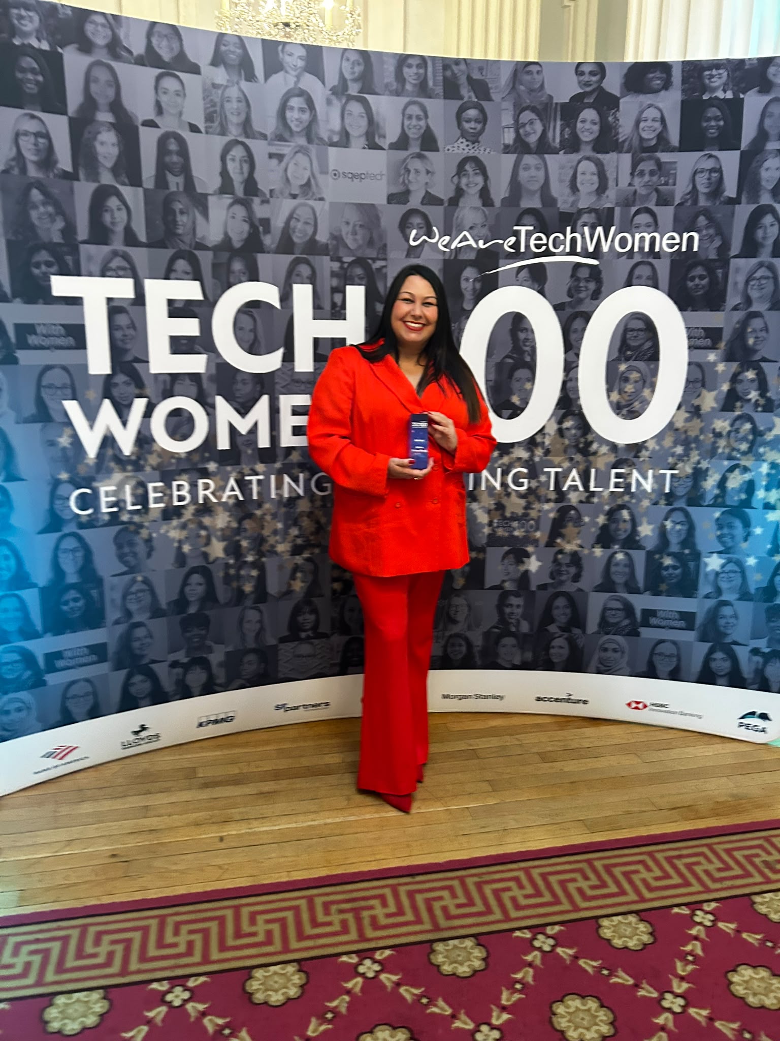 Dr Calcines poses with her award at the TechWomen100 event