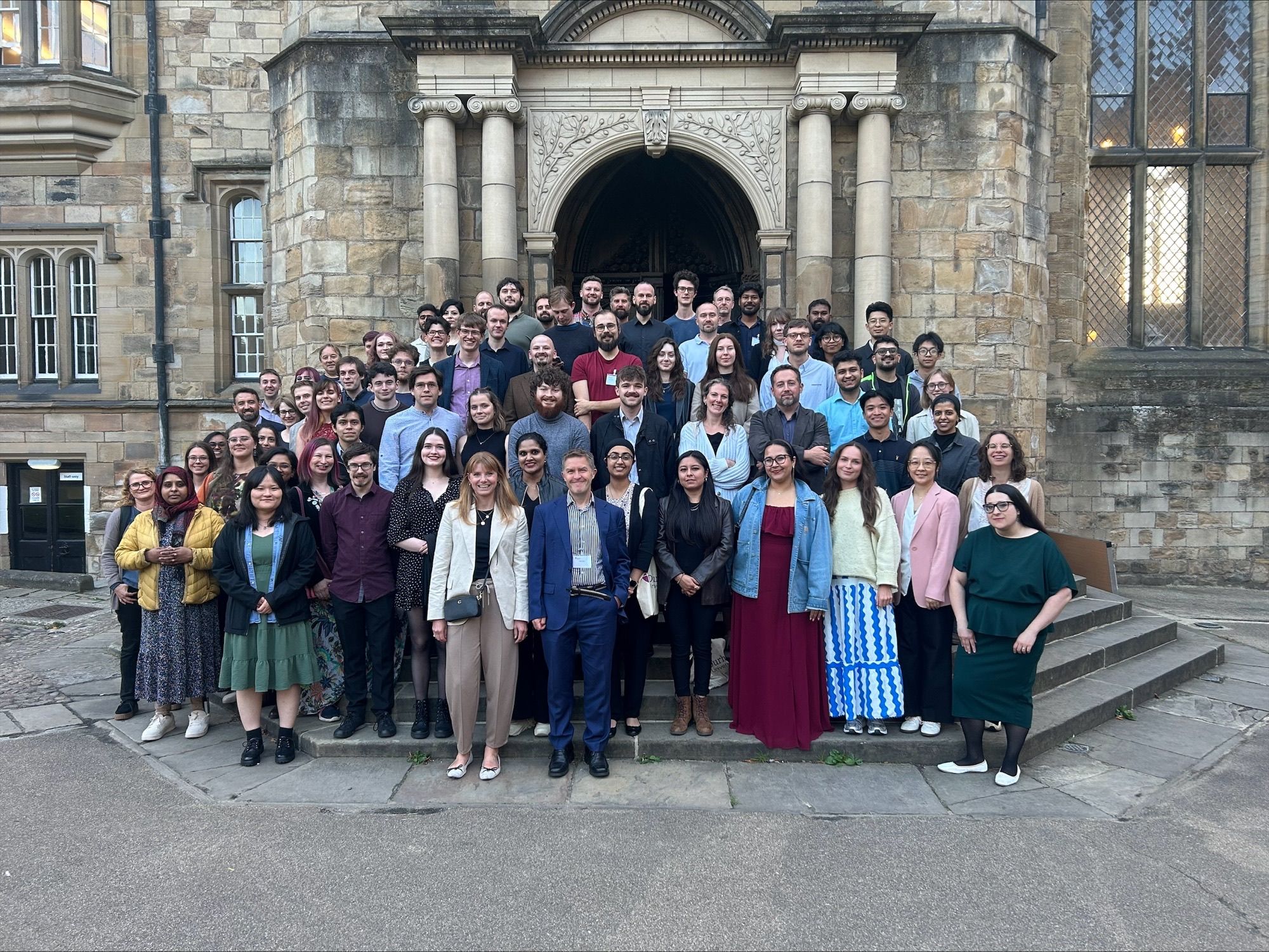 Participants pose outside Durham Castle before the 2025 Summer School dinner