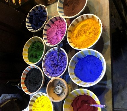 pots  of coloured powered paint