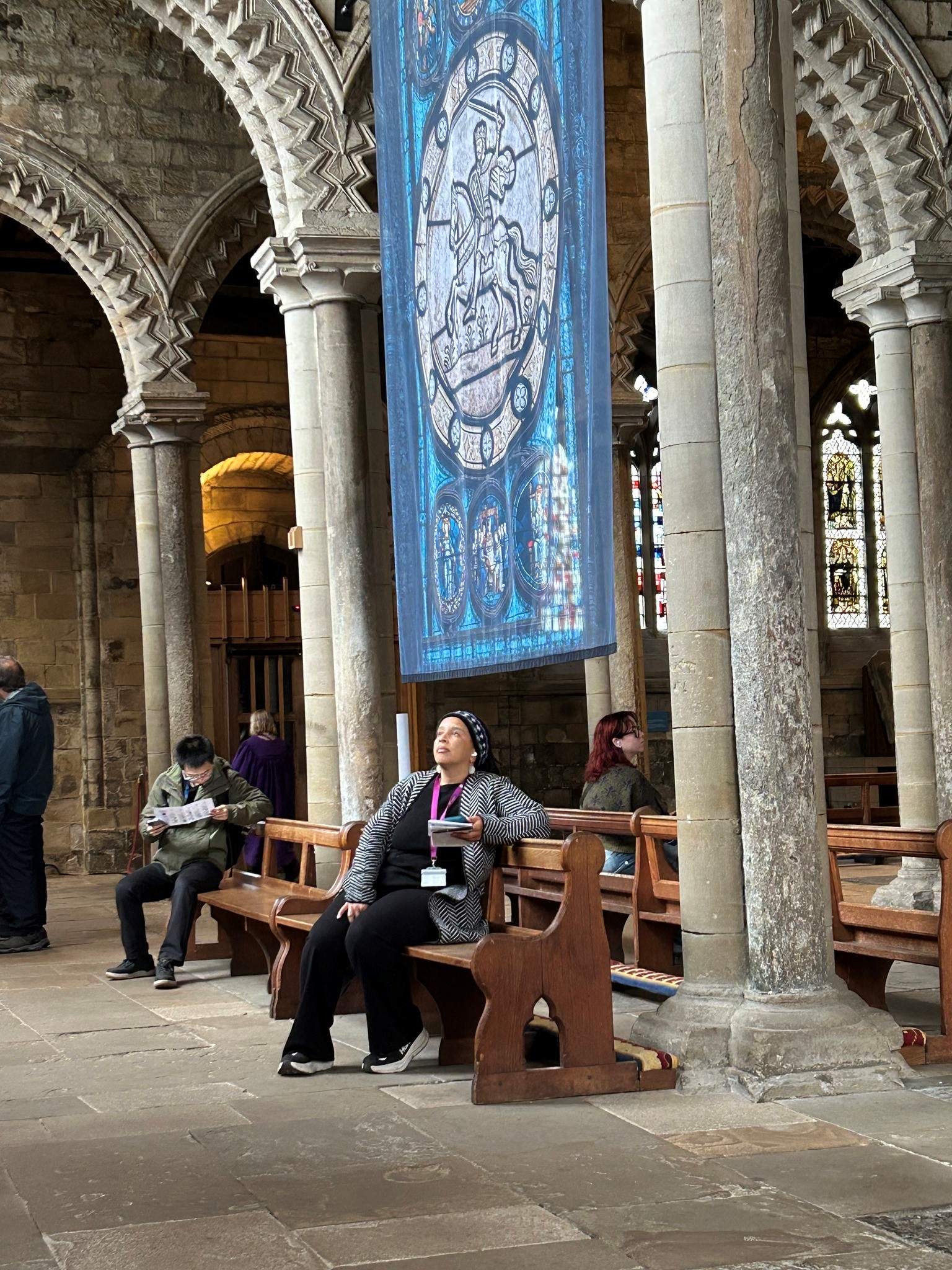 Professor Beth Rose Middleton Manning sitting in Durham Cathedral