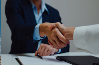 Professional people shaking hands (courtesy of iStock)