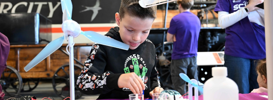A boy enjoying an experiment at Celebrate Science