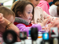 A girl looking at an experiment