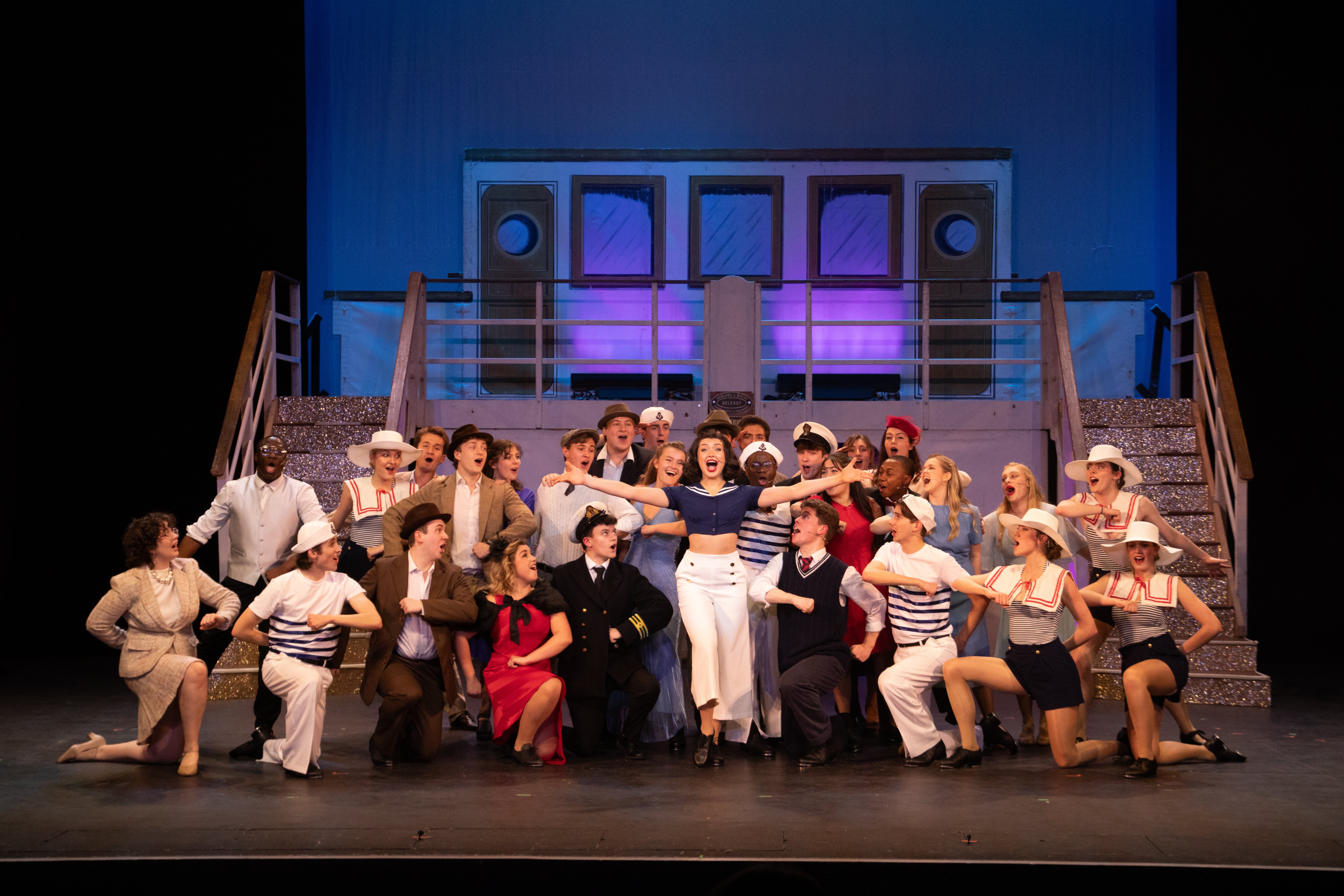 The cast of Durham University Light Opera Group's production of Anything Goes 2024 pose for the end of the first act.