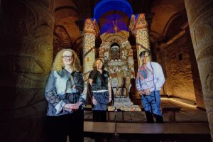 People in the Norman Chapel viewing he light projections Jewel of hte North